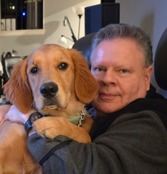 Nick Butcher with his golden retriever, Luna